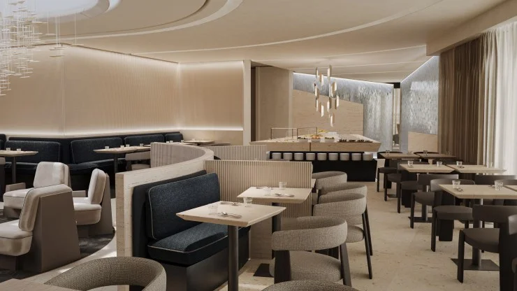 Modern restaurant interior featuring elegant seating, soft lighting, and a stylish decor with a mixture of booths and tables.