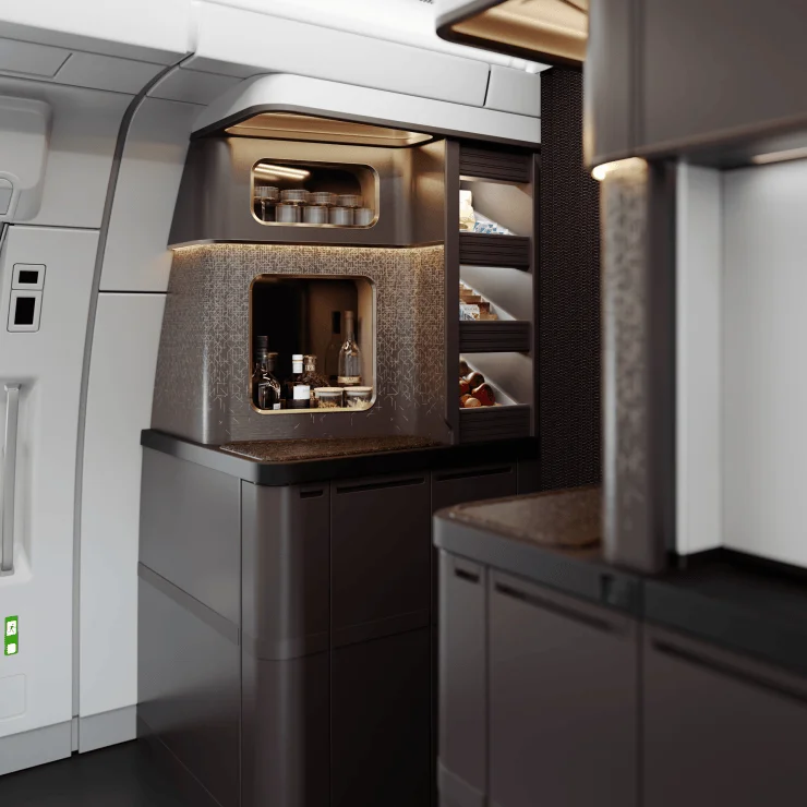 Interior view of a modern aircraft galley featuring cabinets with drinks and snacks, a sleek design with warm lighting.
