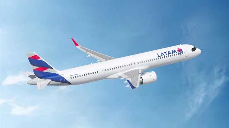 LATAM Airlines airplane flying in a blue sky