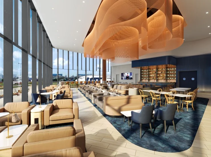 Interior view of a modern airline lounge featuring comfortable seating, large windows, and an attractive ceiling design.