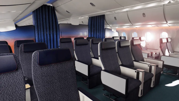Interior view of a modern airplane cabin featuring comfortable seating with navy blue upholstery, natural light coming through the windows, and curtains dividing sections.