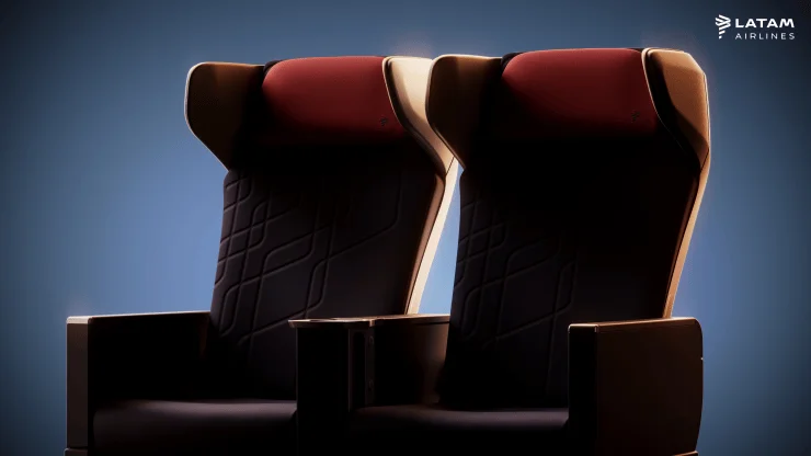 Two LATAM Airlines Premium Comfort seats showcasing ergonomic design with rich red and black upholstery.