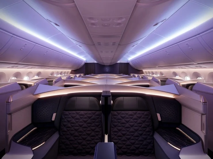 Interior view of Riyadh Air's Business Class cabin showcasing elegant seating, modern design, and ambient lighting.